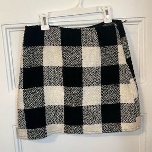 Black and white checkered shirt.